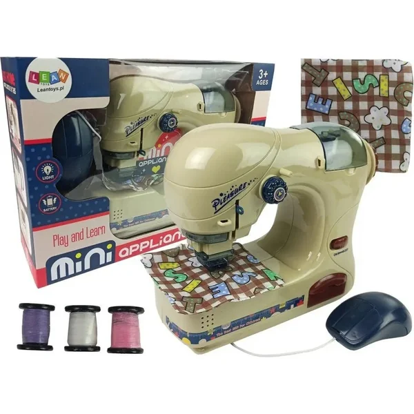 Machine à coudre en plastique 20 cm à piles avec lumière dans une boîte